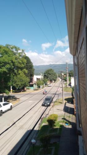 a view of a street with cars parked on the road at Aires del Cerro in Yerba Buena