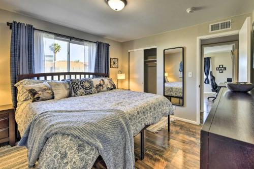 a bedroom with a bed and a dresser and a mirror at Family-Friendly Chandler Home Near Downtown! in Chandler