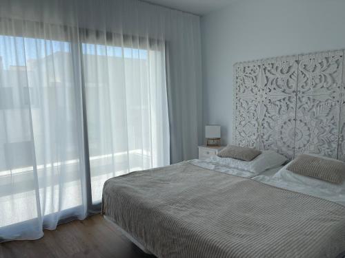 Ένα ή περισσότερα κρεβάτια σε δωμάτιο στο Links II 505 Duplex 2bedroom Apartment GOLF Alcaidesa SPAIN