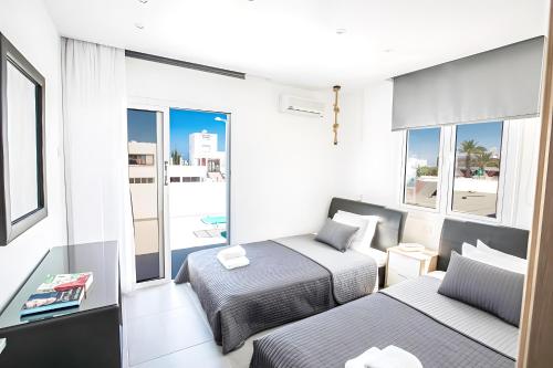 Postel nebo postele na pokoji v ubytování Evas Apartment