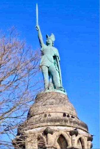 a statue of a woman on top of a tower at Exklusives Wohnen am Stadtpark in Bad Driburg