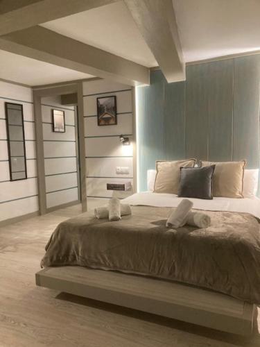 a bedroom with a large bed with towels on it at Villa Palma in Marbella
