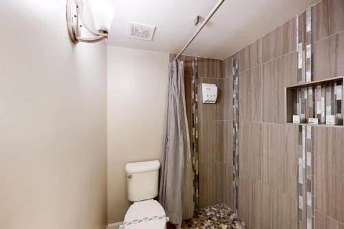 a bathroom with a toilet and a shower at Golden Oasis, Unit #110 in Scottsdale