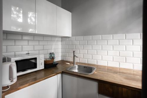 Kuchyň nebo kuchyňský kout v ubytování Apartament Atłasowy by Good Time