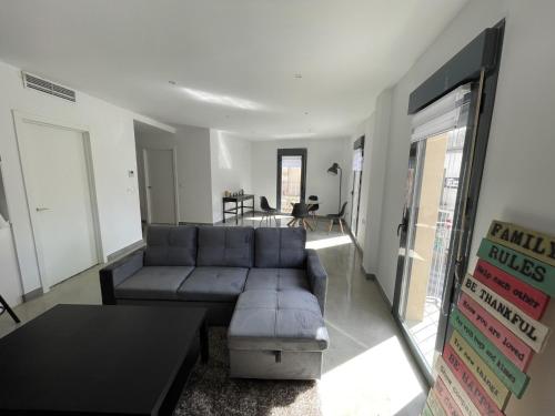 a living room with a couch and a table at El Mentidero AT-CC-00762 in Coria