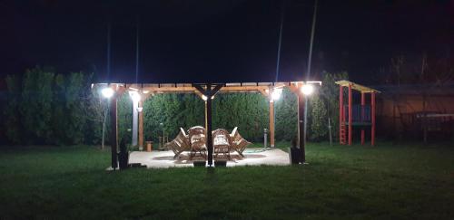 a park at night with lights and a playground at Luxury house "Heart of Nature" Visoko in Visoko