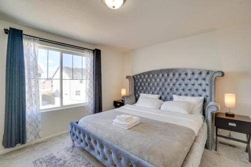 a bedroom with a large bed with a large window at Aurora Vacation Rental about 18 Mi to Downtown Denver! in Aurora