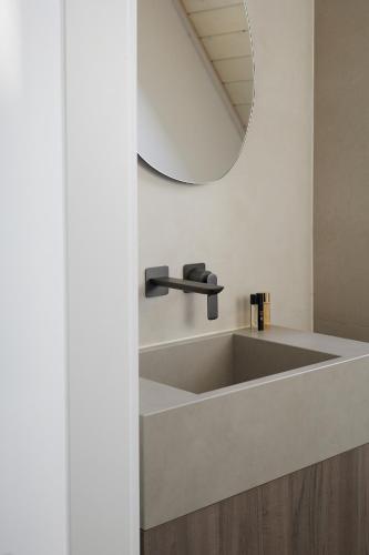 a bathroom with a sink and a mirror at Górski Domek Zakopane in Kościelisko