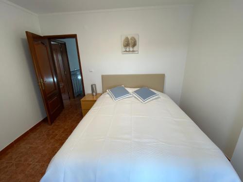 Postel nebo postele na pokoji v ubytování Ericeira Sand Beach R5