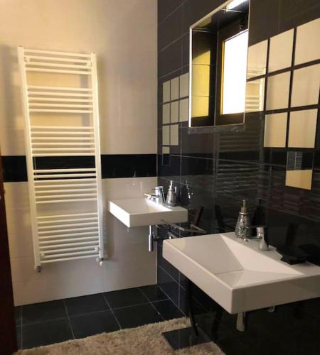 a bathroom with two sinks and a mirror at Private Pool & House - Serenity Villa in Ancião