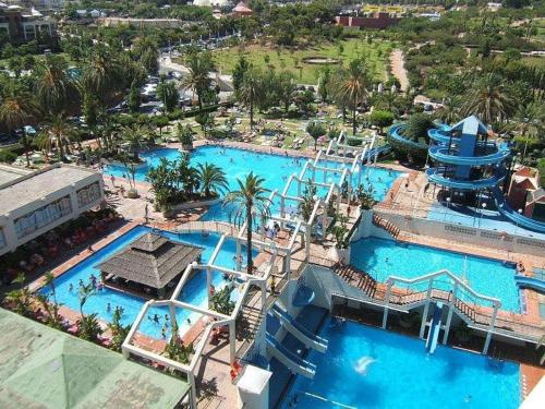 an aerial view of a water park with two pools at Benalbeach Penthouse Sea View in Benalmádena