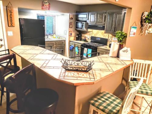 a kitchen with a large island in a kitchen at White Sands Oasis in Alamogordo