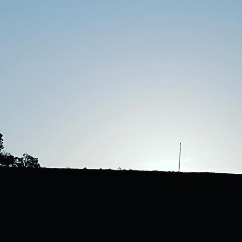 a pole on top of a hill with the sky in the background at Pousada Vida feliz in Águas de Lindóia