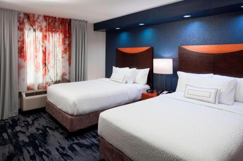 a hotel room with two beds and two lamps at Fairfield Inn & Suites by Marriott Austin Parmer Tech Ridge in Austin