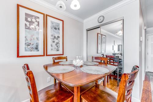 a dining room with a wooden table and chairs at Sunset Harbor Palms 2-304 in Navarre
