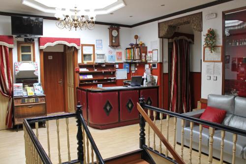 a shop with a staircase leading to a store at Pensão França in Porto