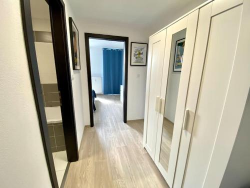 a hallway with a door leading to a room at Two-room apartment with garage in the center in Pilsen