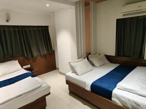 Katil atau katil-katil dalam bilik di Hotel Anand Palace
