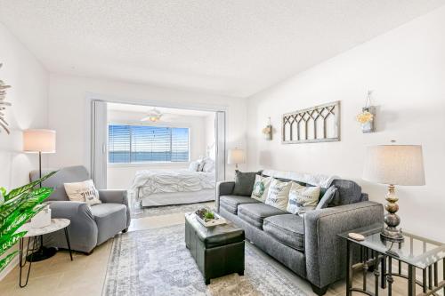 a living room with a couch and a chair at Sunset Harbor Palms 1-308 in Navarre