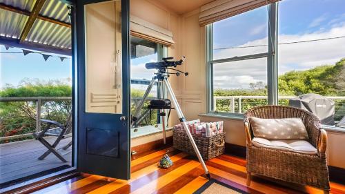 a room with a camera on a tripod next to a window at Bantry Two in Merimbula