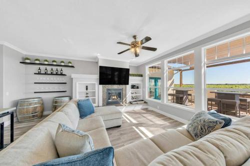 a living room with a couch and a fireplace at Luxe & Comfy Vineyard Estate ~ Breathtaking Views! in Clarksburg