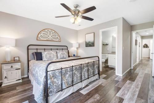 a bedroom with a bed and a ceiling fan at Spruce Valley in Branson