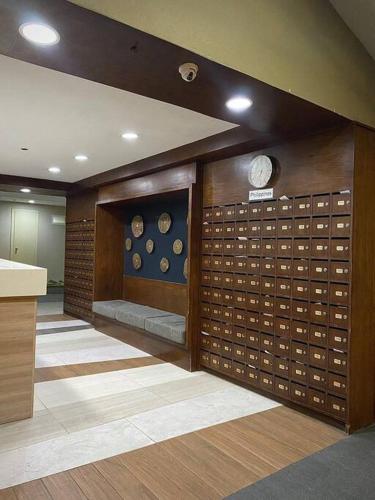 a room with a wall with a bunch of buttons at The Nearest Studio from MactanAirport with Disney+ in Pusok