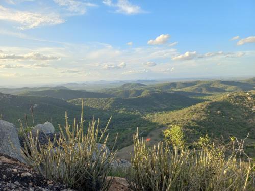 a view of the hills from the top of a mountain at Recanto Familiar in Monte das Gameleiras