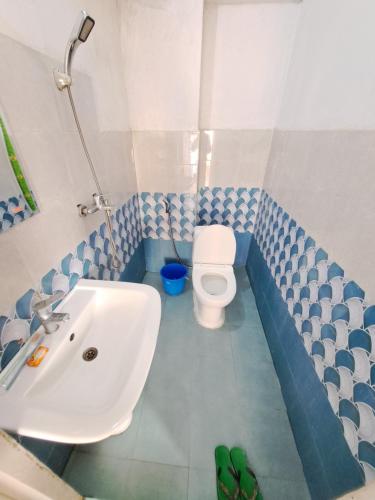 Koupelna v ubytování Hong Qi Hotel