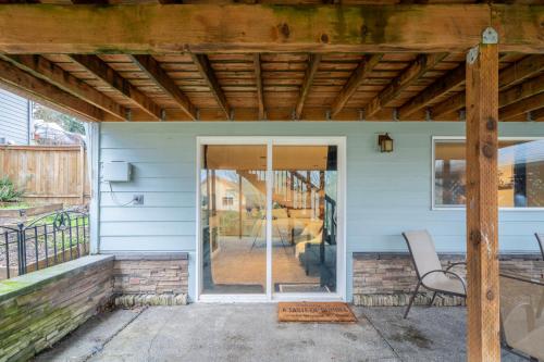 a porch with a glass door and a chair on it at A Taste Of Dundee in Dundee