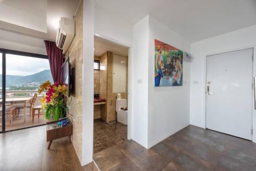 a living room with a view of a bathroom at PATONG TOWER SEA VIEW 3&4 BEDROOMS pta 2026 in Patong Beach