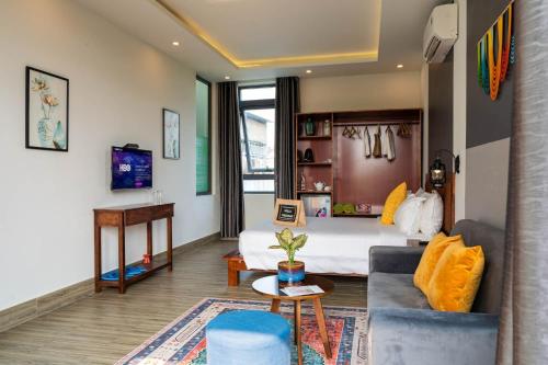 會安的住宿－An Bang MQ Villa，酒店客房,配有床和沙发