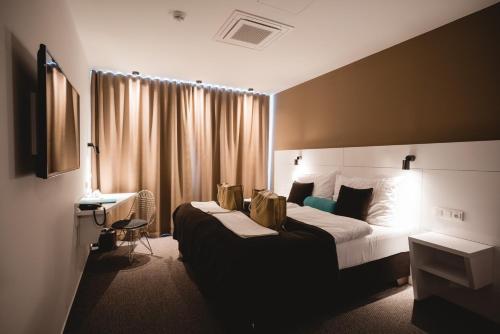 Postel nebo postele na pokoji v ubytování Hotel Thermal ŠÍRAVA