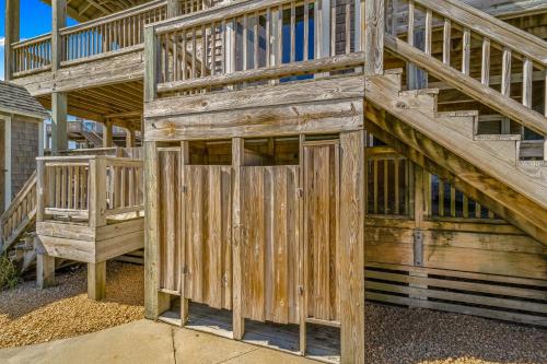 a large wooden building with a wooden door at Hatteras Memories in Hatteras