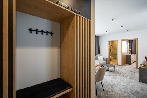 a living room with a fireplace and a living room with a couch at Chalet Pod Brdom - Apartments in Ružomberok
