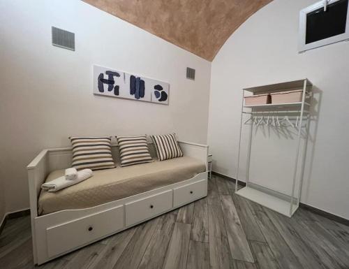 a bedroom with a bed with pillows on it at I SASSI BLU in Riomaggiore