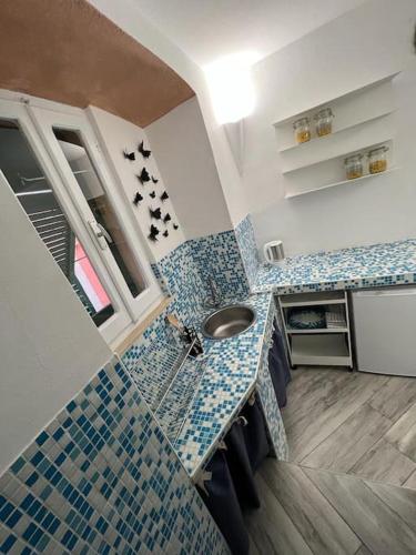 a bathroom with a sink and a counter top at I SASSI BLU in Riomaggiore