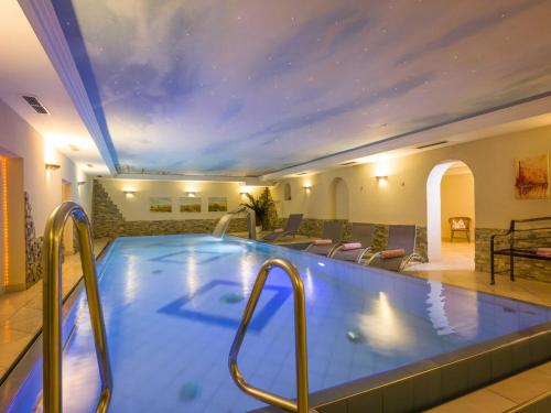 a swimming pool in a hotel room with at Apartment in Stumm near Zillertal Ski Area in Stumm