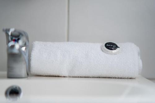 a roll of white paper towels sitting on a sink at The Wheelhouse, 3 bed sleeps 6, Parking and wi-fi in Washington