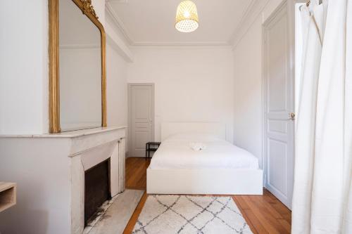 Posteľ alebo postele v izbe v ubytovaní L'Annexe de Stanislas