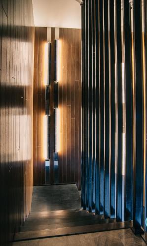 a hallway of a building with a wooden wall at Expressionz Professional Suites by MyKey in Kuala Lumpur