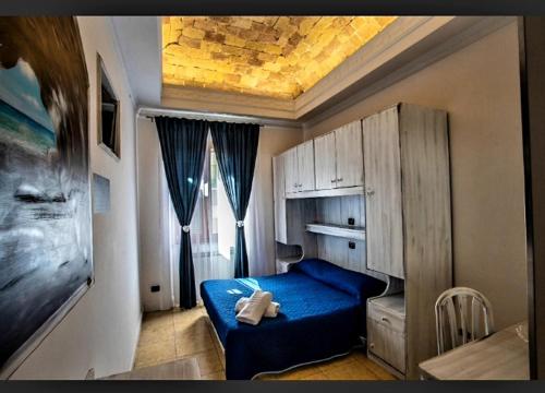 Postel nebo postele na pokoji v ubytování Golfo di Orosei rooms