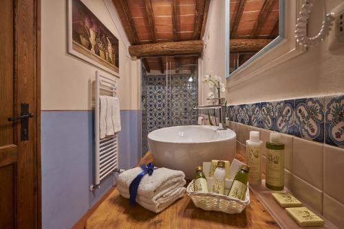 a bathroom with a sink on a wooden table at Hotel Belvedere Di San Leonino in Castellina in Chianti
