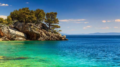 a small island in the middle of the water at Apartman Lara in Brodarica
