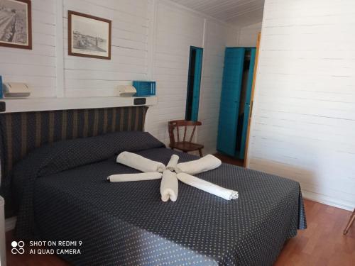 Un pat sau paturi într-o cameră la Hotel Paradiso Dei Giovani