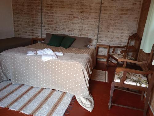 Ein Bett oder Betten in einem Zimmer der Unterkunft Reobote Chalés
