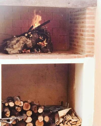 a brick oven with a fire inside of it at Casa Rural con encanto Señorio Manchego ALBACETE in Yeste
