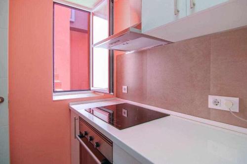 a kitchen with a sink and a window at Apartamento único en Muralla Roja - 0412 in Calpe