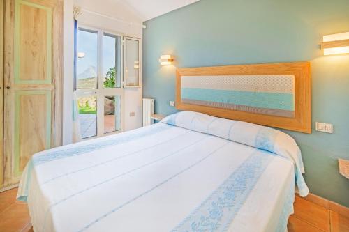 Postel nebo postele na pokoji v ubytování Residence Hotel Lu Nibareddu