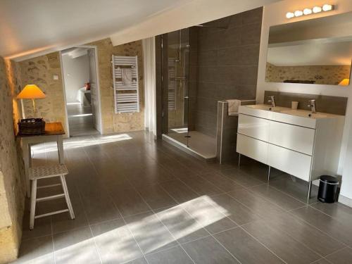 a large bathroom with a sink and a shower at Domaine sur les coteaux de Loupiac in Loupiac-de-Cadillac